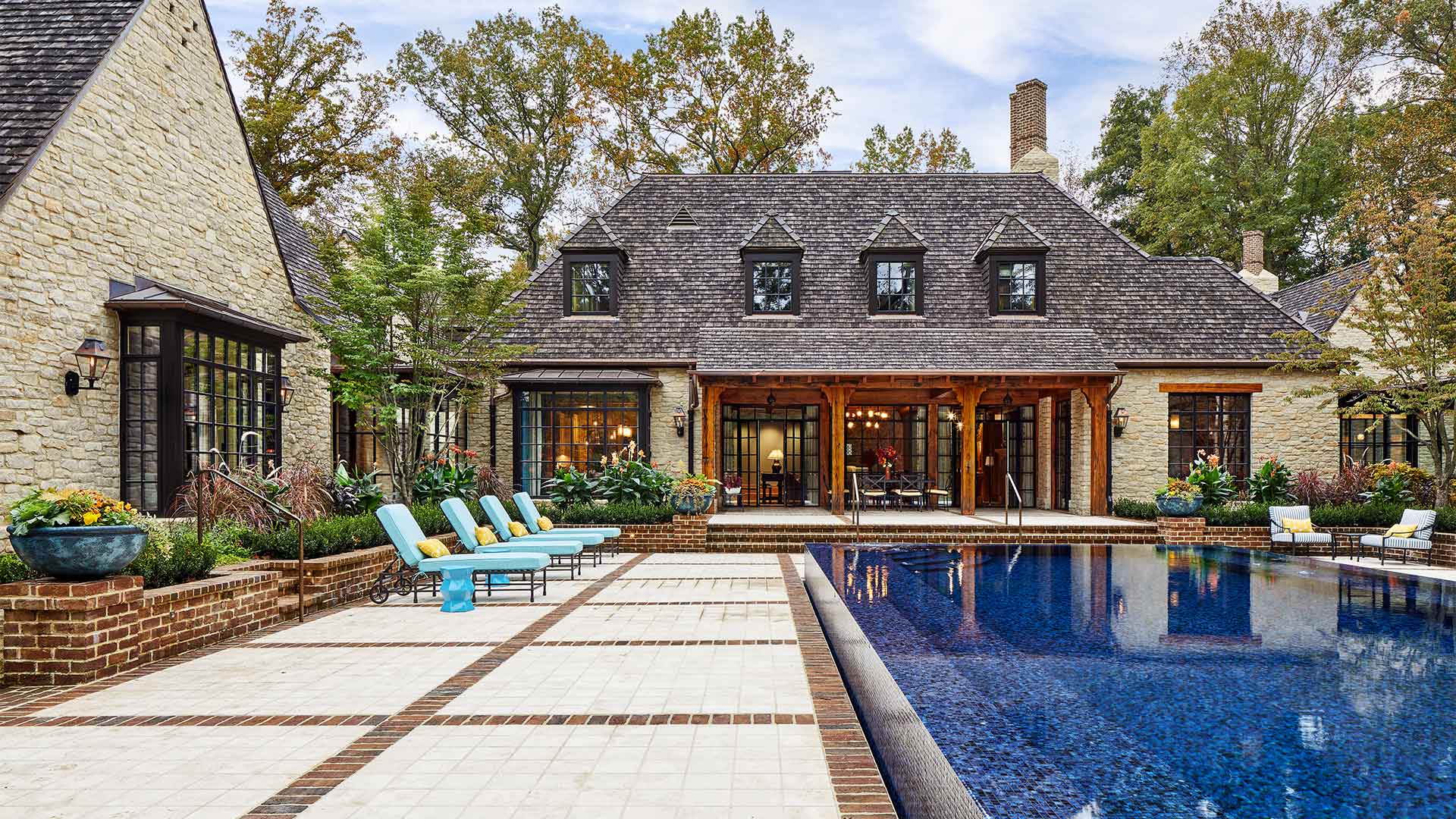 A fancy big house with a pool