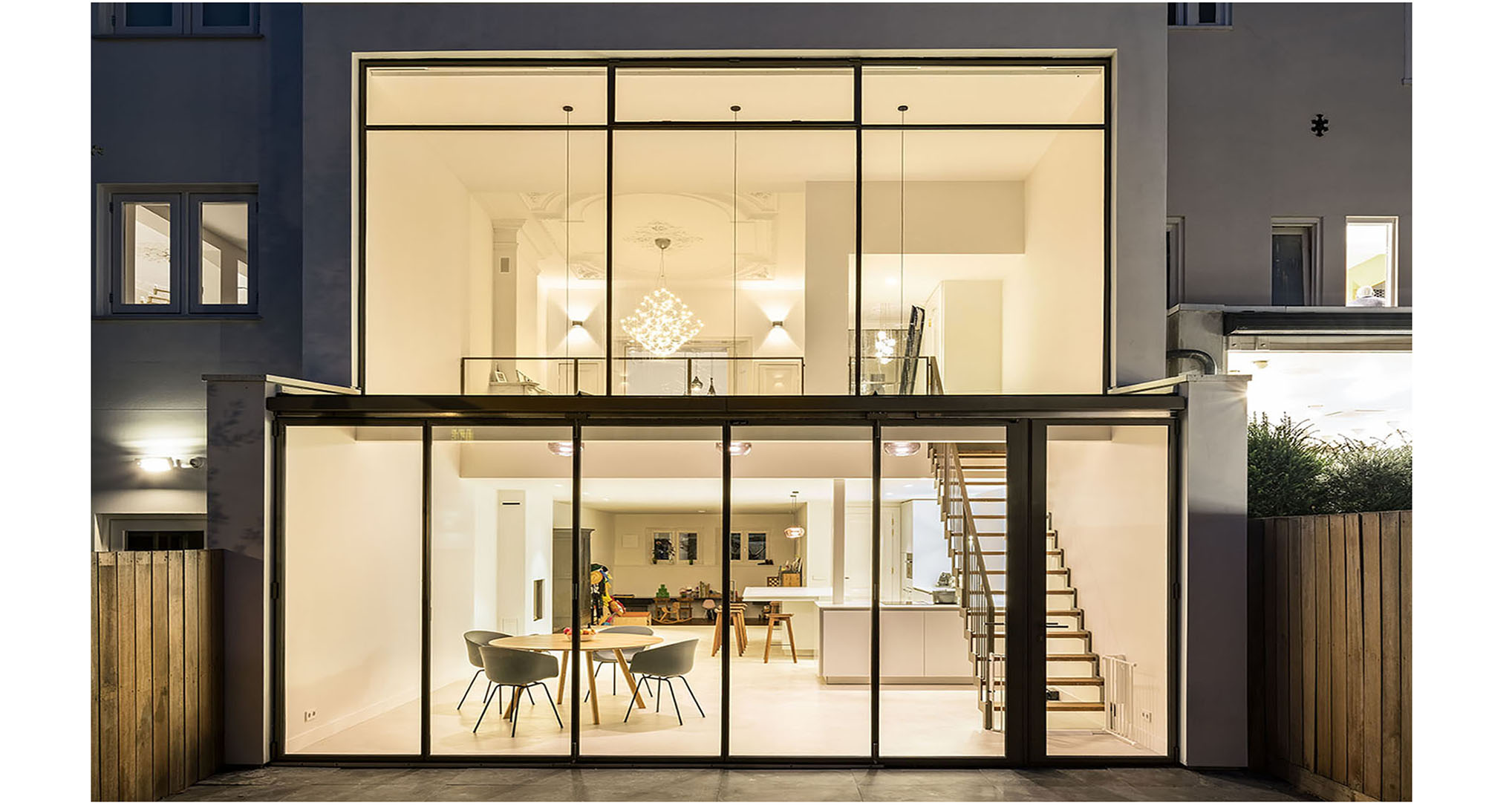 The interior visible through MHB folding doors of a residence in Amsterdam, the Netherlands long