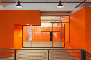 JIP project with bright orange walls and a mondriaan like MHB glazed wall